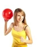 6675630-pretty-smiling-young-blond-woman-in-sportive-cloths-holding-red-ball