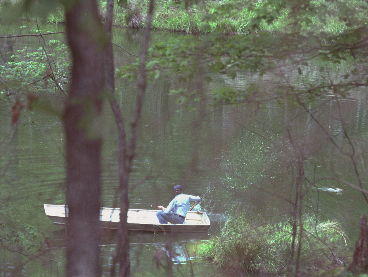 Jimmy_Carter_in_boat_chasing_away_swimming_rabbit,_Plains,_Georgia_-_19790420.jpg