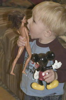 little-boy-kissing-barbie-dolls-breasts1.jpg