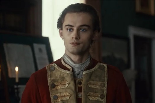 Young George in his uniform, looking restrainedly unhappy.